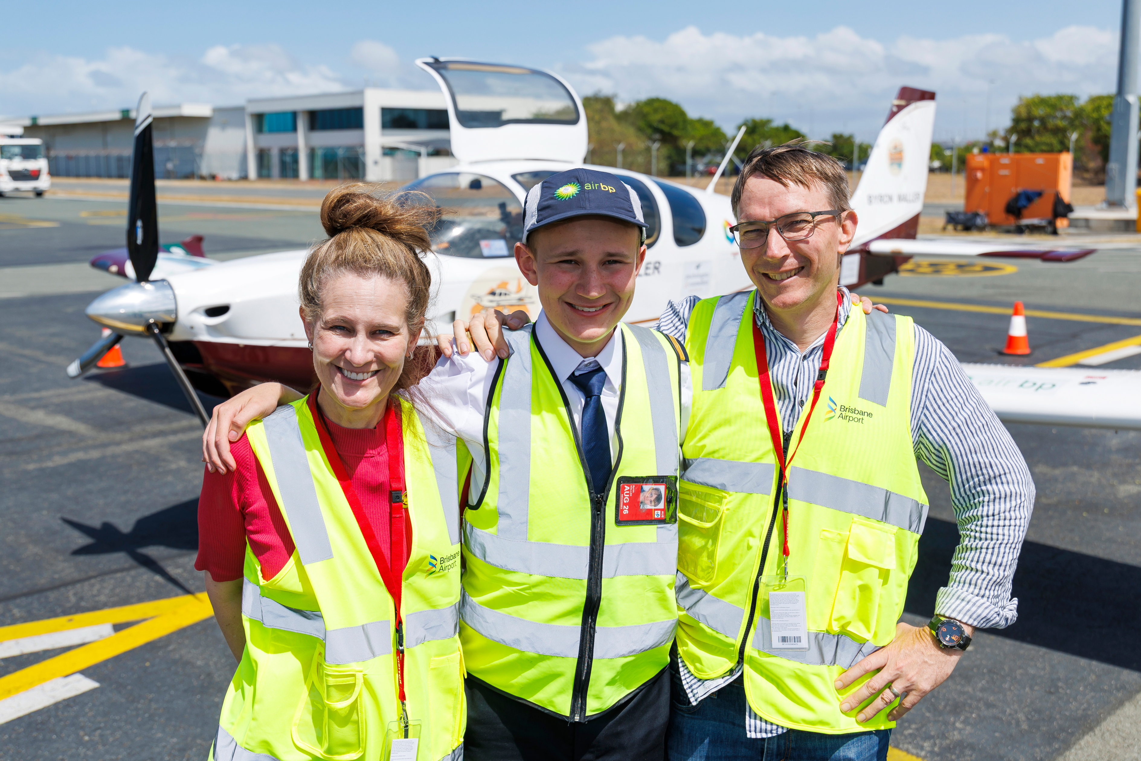 Family on tarmac · VH-ZMD, Brisbane